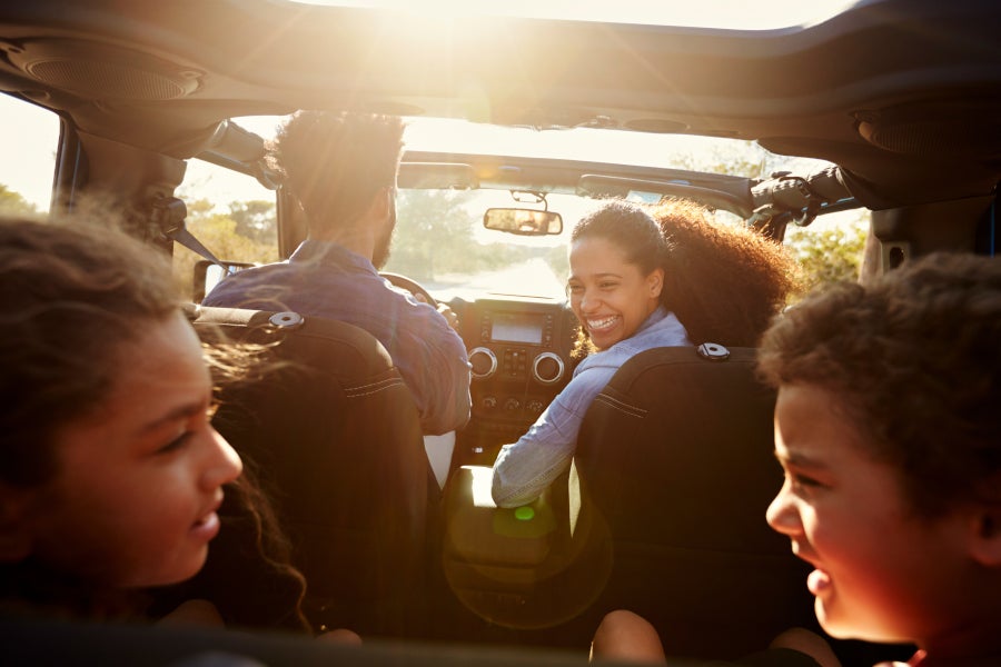Happy family inside a car